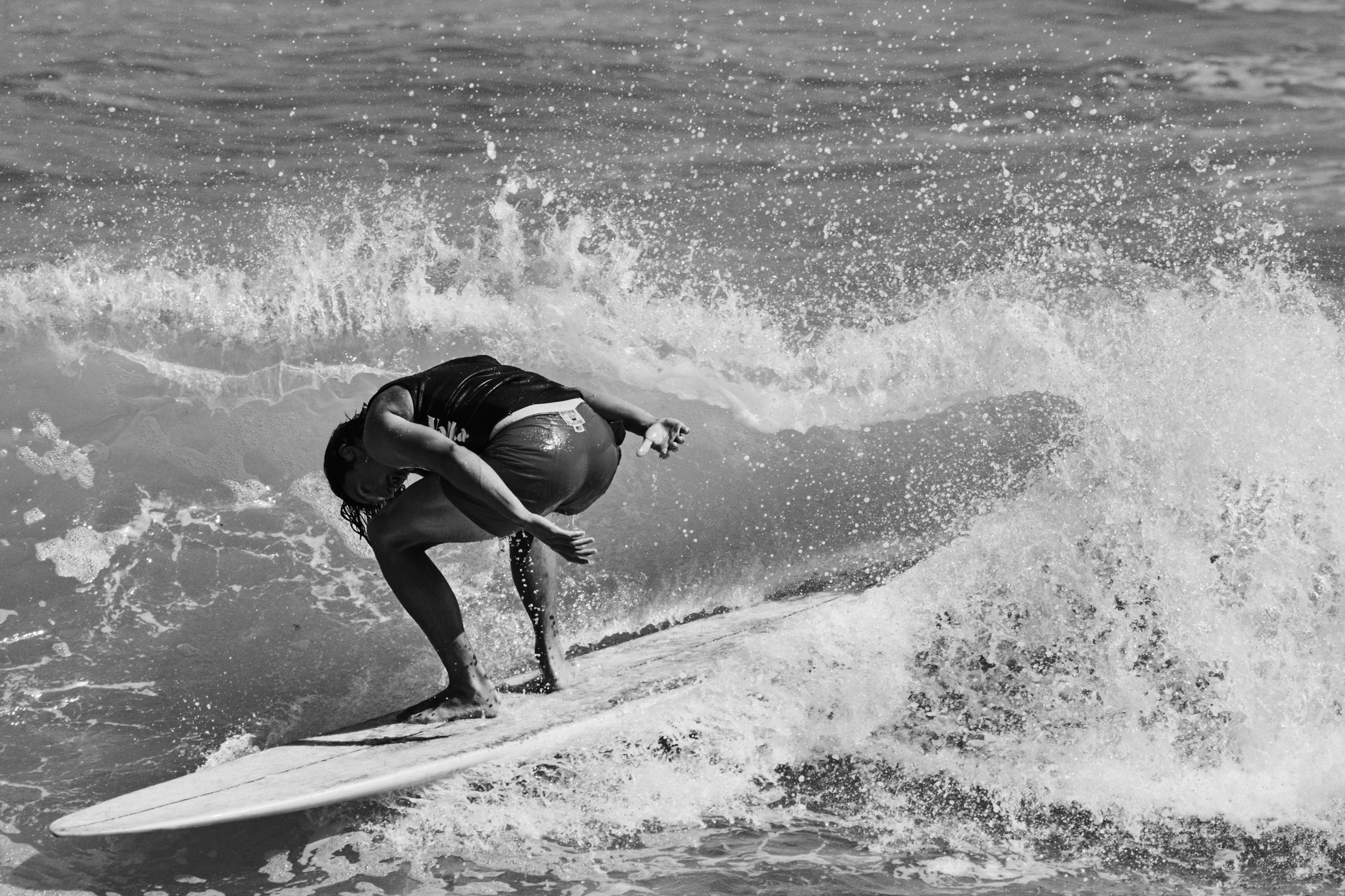 Venice Beach, California: A surfer on the waves at Malibu. Photo by Matthew Brookes, from Into the Wild, published by Damiani​