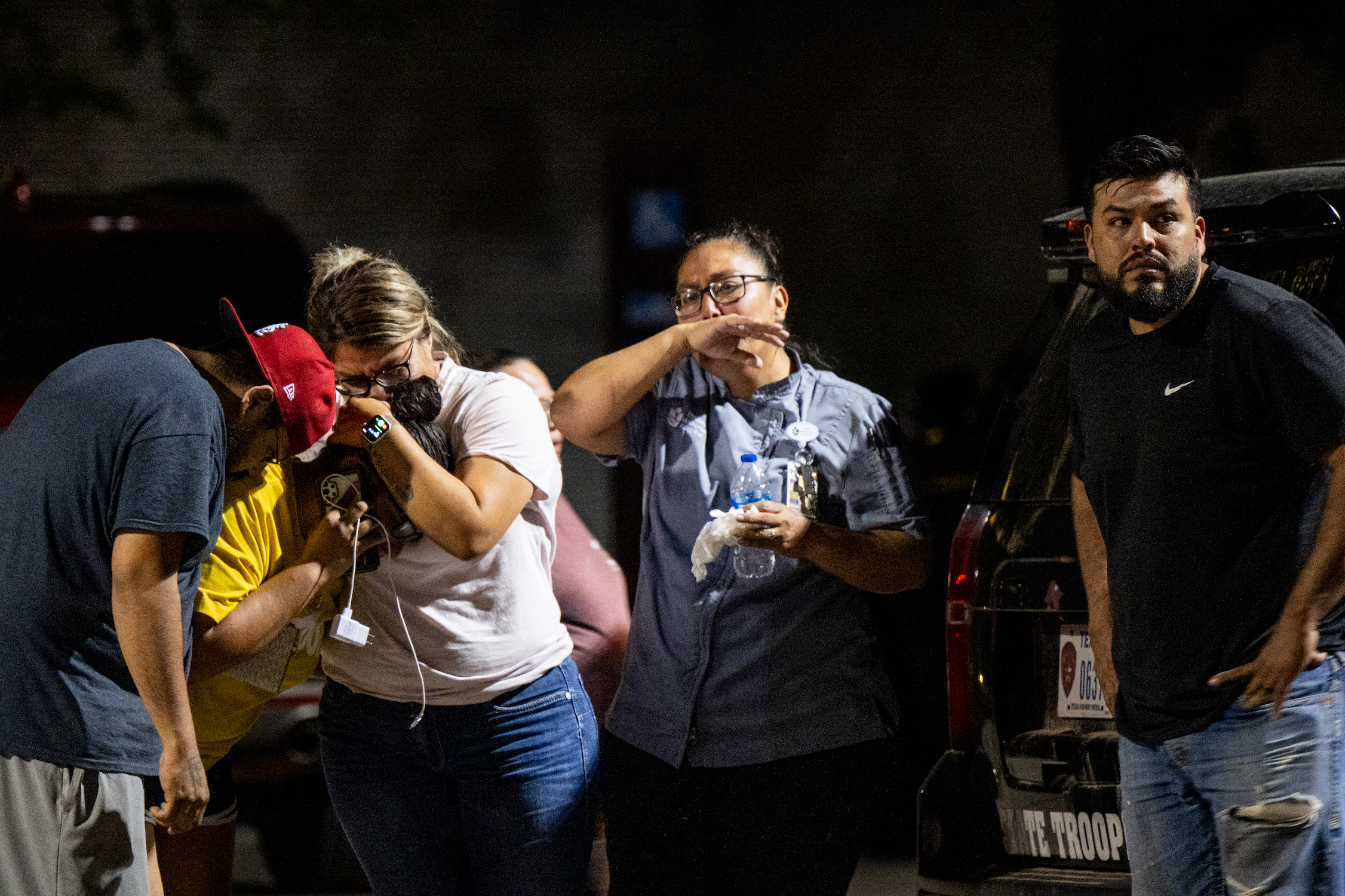 Family members cry as they wait for news about their loved ones. Photo: Brandon Bell / GETTY IMAGES NORTH AMERICA / Getty Images via AFP