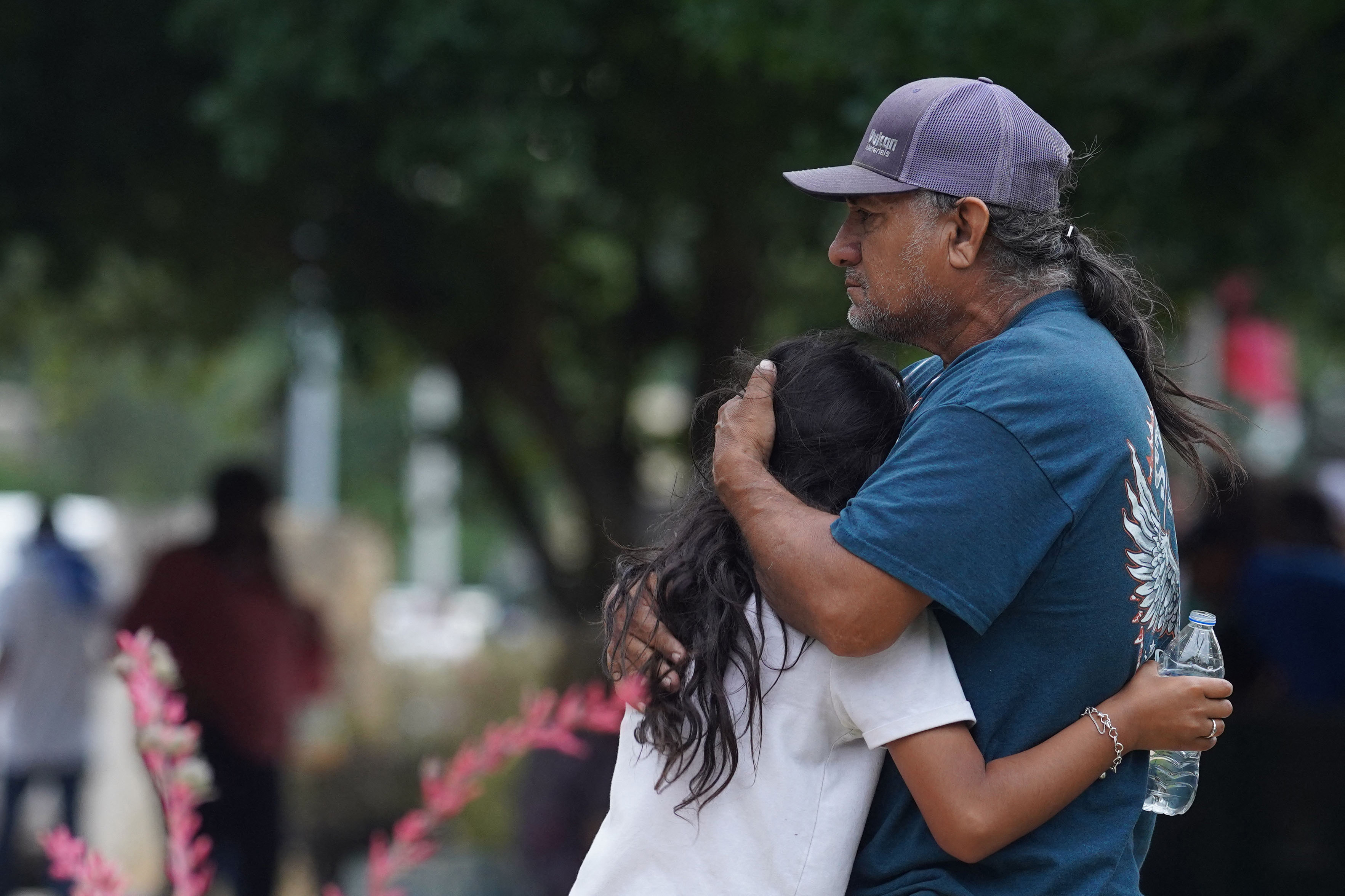 Families were seen grieving outside the elementary school as they waited for news about the students. Photo: Allison Dinner / AFP