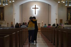 People attend a Mass at Sacred Heart Catholic Church in Uvalde Texas, on May 25, 2022, one day after a gunman opened fire at Robb Elementary school.