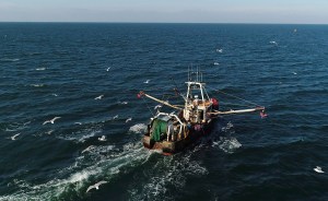 A fishing trawler makes its way to open water from Montauk, N.Y. for a day trip to fish off the coast Long Island on Tuesday, Dec. 19, 2017.