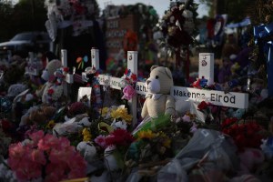 Flowers, plush toys and wooden crosses are placed at a memorial dedicated to the victims of the mass shooting at Robb Elementary School on June 3, 2022 in Uvalde, Texas.