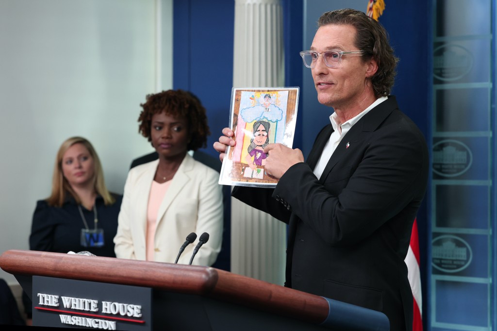 After meeting with President Joe Biden, Actor Matthew McConaughey holds up artwork by one of the victims of the school shooting in Uvalde, Texas, during the daily news conference in the Brady Press Briefing Room at the White House on June 07, 2022 in Wash