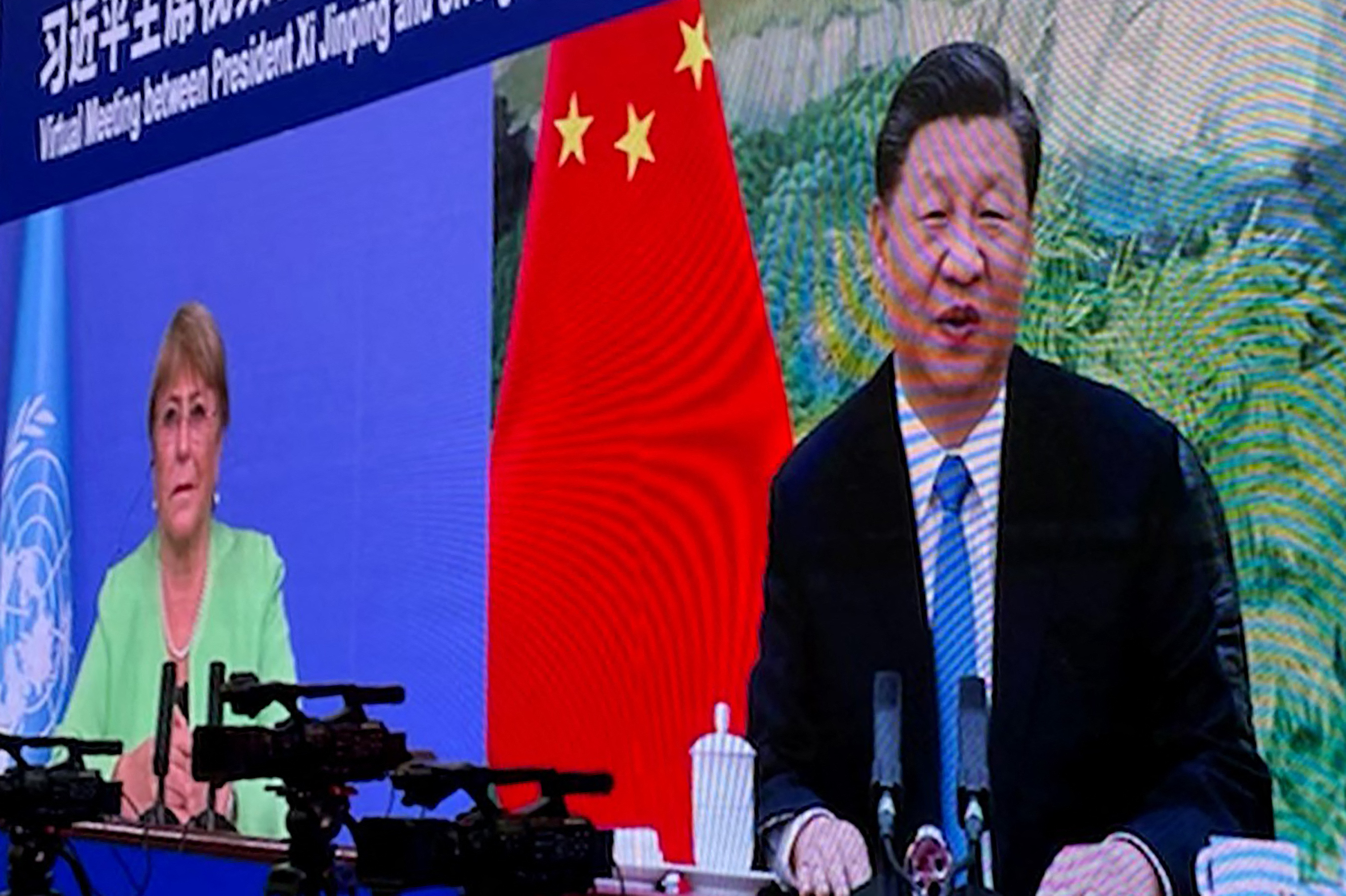 Michelle Bachelet (left) attends a virtual meeting with China's President Xi Jinping in Guangzhou on May 25, 2022. Photo: Handout / OHCHR / AFP