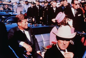 President John F. Kennedy and  Jackie Kennedy appear in a motorcade in Texas. Kennedy was shot in the same car.