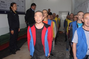 An image from the Xinjiang Police Files shows detainees guarded by Chinese police in a detention centre.​ ​Photo: HANDOUT / THE VICTIMS OF COMMUNISM MEMORIAL FOUNDATION / AFP