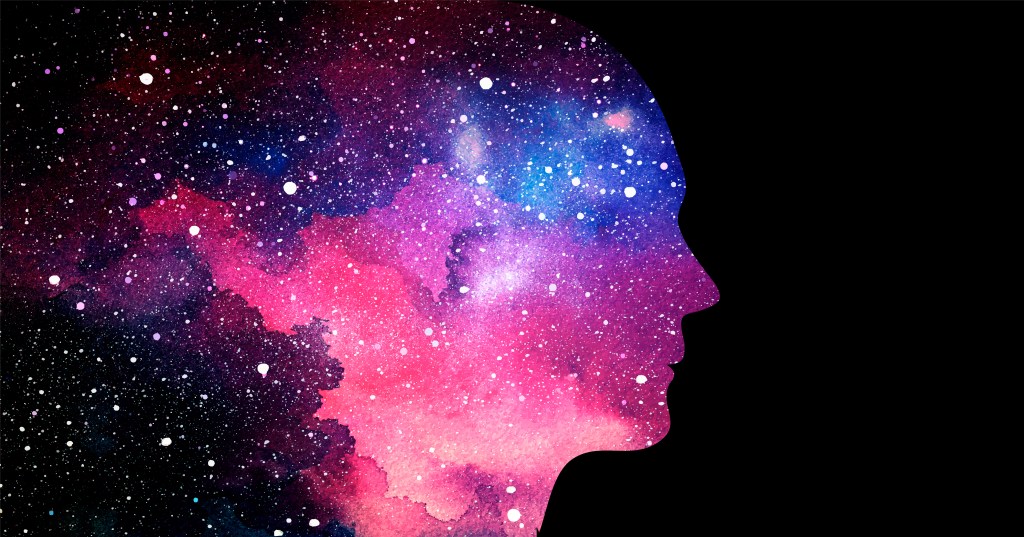 A silhouette of a human face with a pink and blue outer space background.