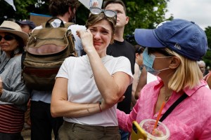 Abortion-rights activist Ali Stovall is comforted as she reacts to the announcement to the Dobbs v Jackson Women's Health Organization ruling in front of the U.S. Supreme Court on June 24, 2022 in Washington, DC.