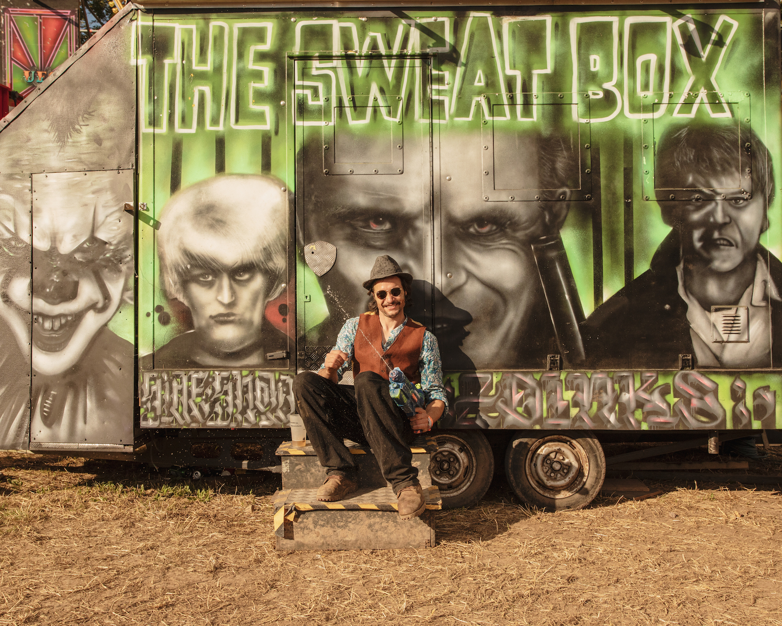 Man hanging out by his van at Glastonbury 2022