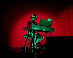 A performer dressed in a skull mask at Glastonbury 2022