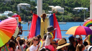 A drag queen performs with arms spread wide during Bermuda's 2019 Pride festival.