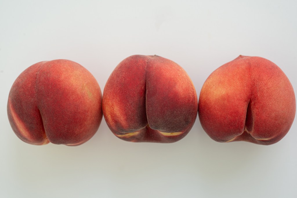 Three peaches in a row.