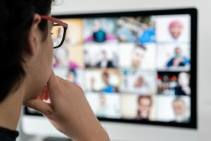 A person looking at a video call screen.