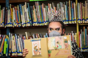 Drag queen Just JP reads stories to children during a Drag Story Hour at Chelsea Public Library in Chelsea, MA.