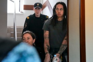 WNBA All-Star Brittney Griner is escorted to a courtroom for a hearing just outside Moscow, Russia, on June 27.