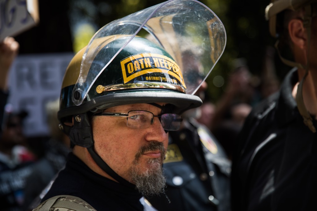 An Oath Keeper, brought on to provide security, stands guard during a pro-Donald Trump rally at Martin Luther King Jr. Civic Center Park in Berkeley, California on April 27, 2017.