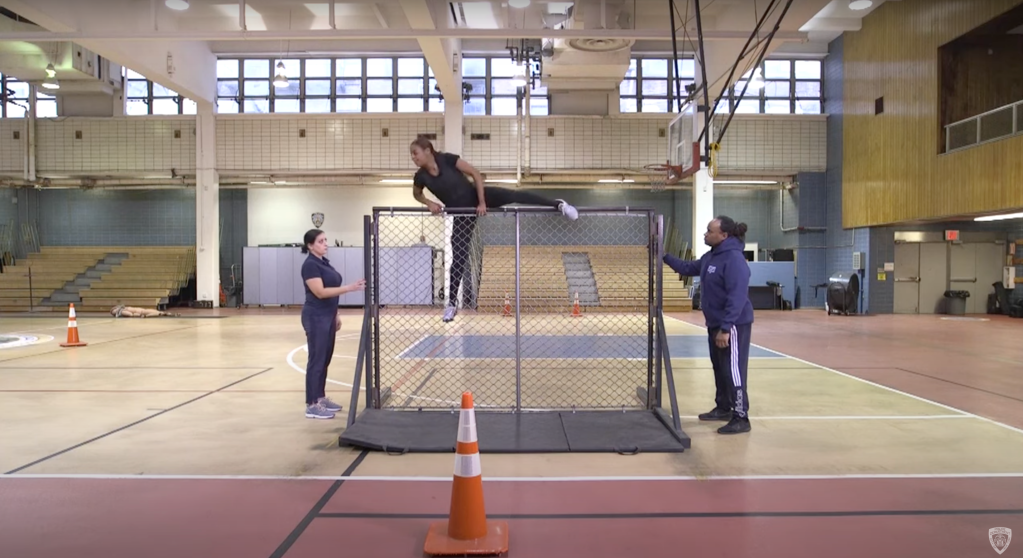 If you think you can climb this chain-link fence, consider applying to be a cop for the NYPD.