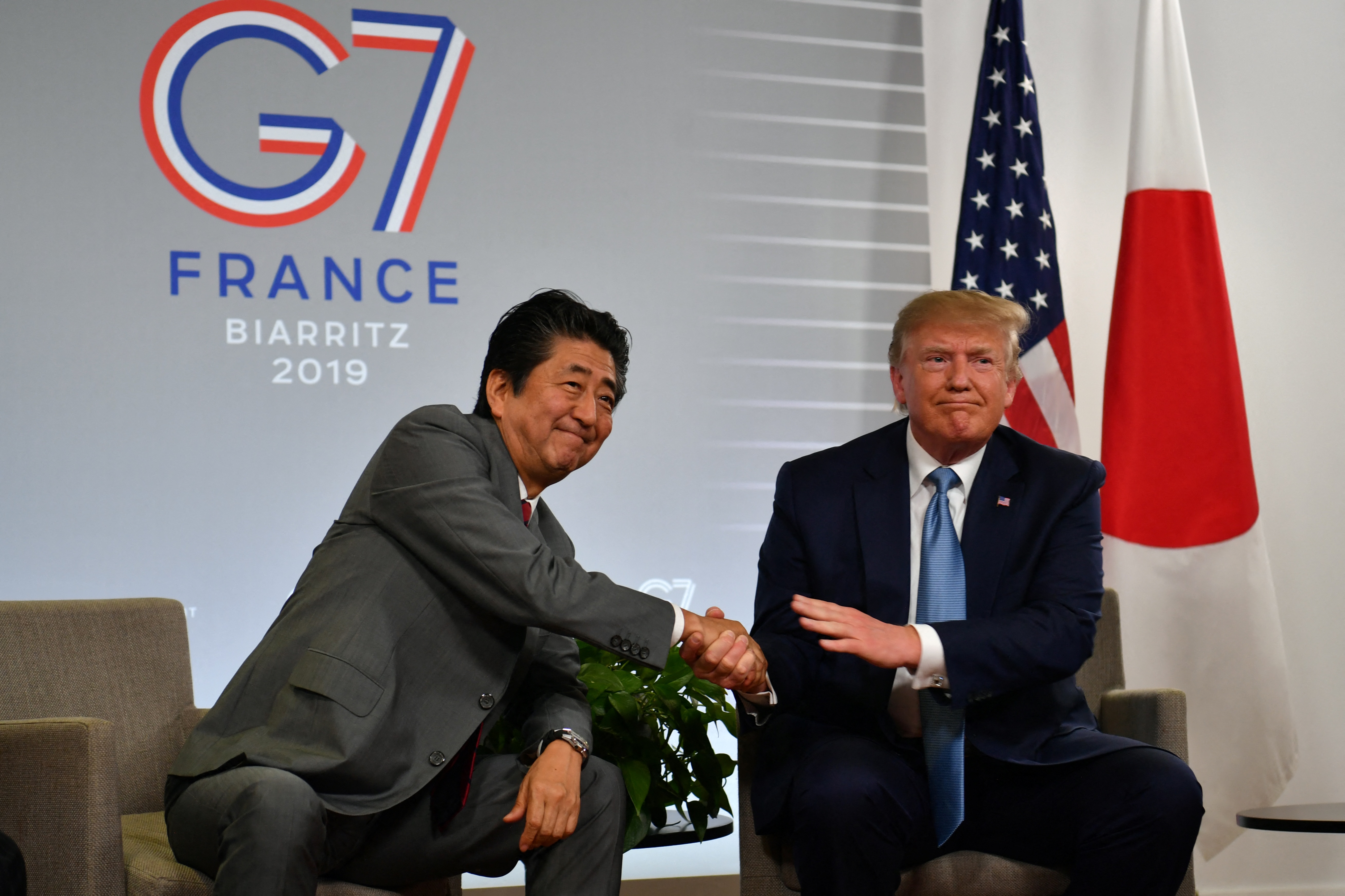 LATE JAPANESE PRIME MINISTER SHINZO ABE SHOOK HANDS WITH THEN US PRESIDENT DONALD TRUMP IN 2019. PHOTO: NICHOLAS KAMM/AFP