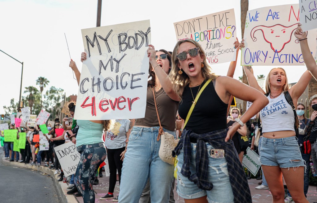 Abortion rights protesters chant during a Pro Choice rally at the Tucson Federal Courthouse in Tucson, Arizona on Monday, July 4, 2022. (SANDY HUFFAKER/AFP via Getty Images)