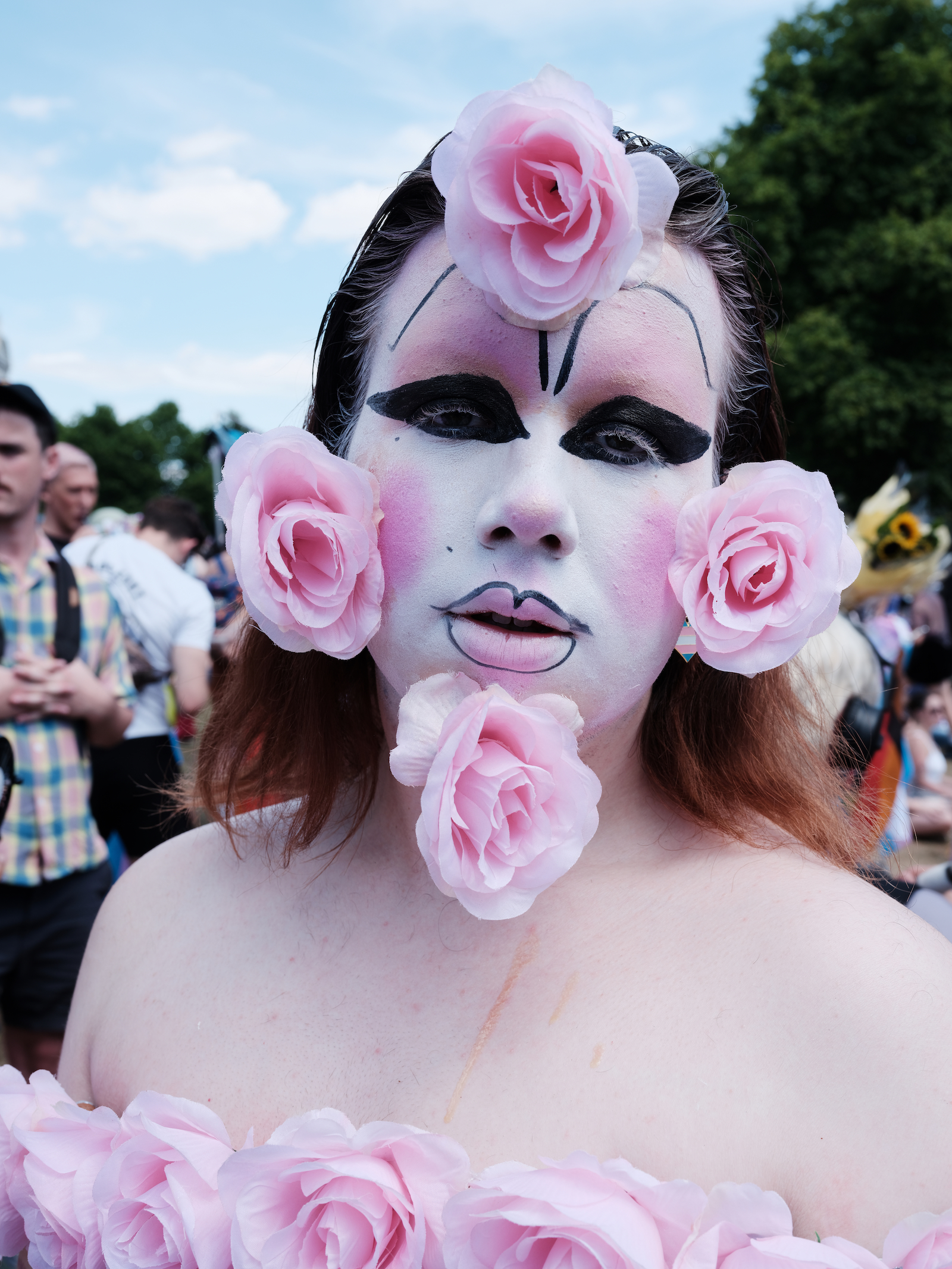 protester in flowers at London Trans+ Pride 2022