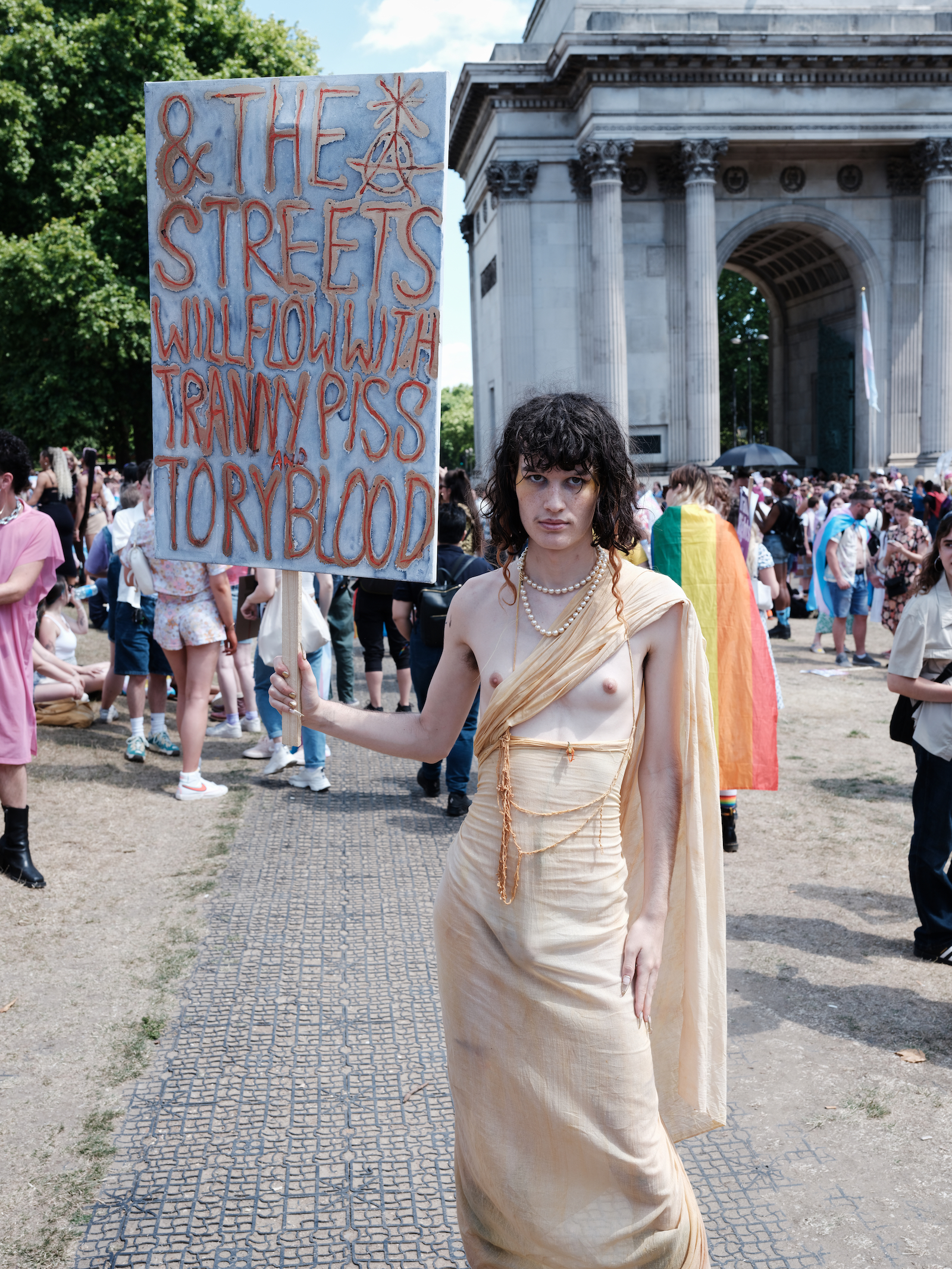 protester holding a sign at London Trans+ Pride 2022