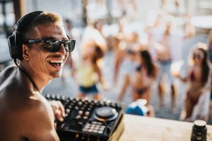 Smiling DJ at beach