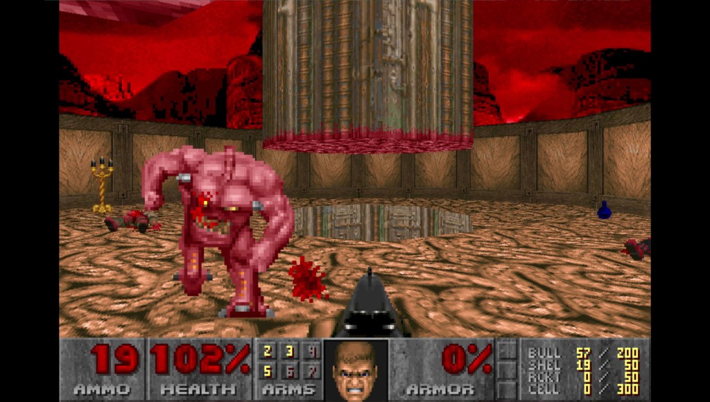 A screenshot from Ultimate Doom where a demon charges at the player, who holds a shotgun.