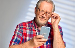 Man looking at phone. Getty Images