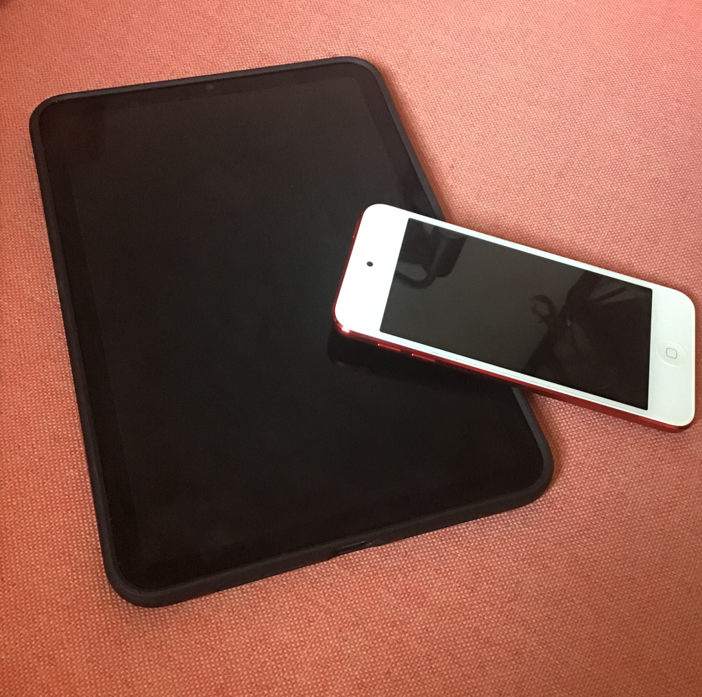 An iPad Mini compared to an iPod.