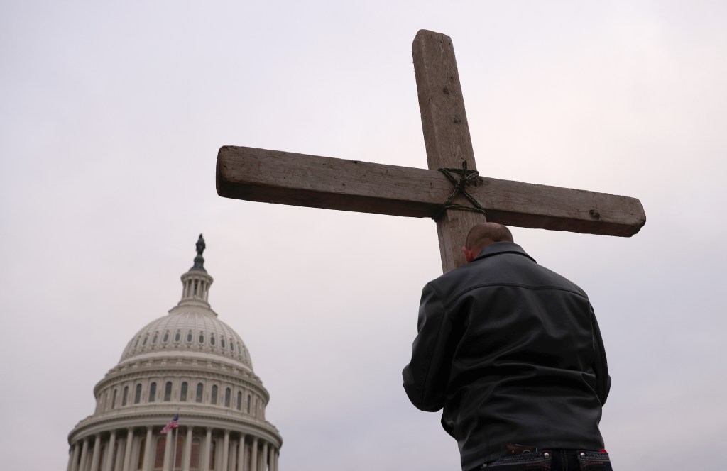 Supporters of U.S. President Donald Trump pray outside the U.S. Capitol January 06, 2021 in Washington, DC.