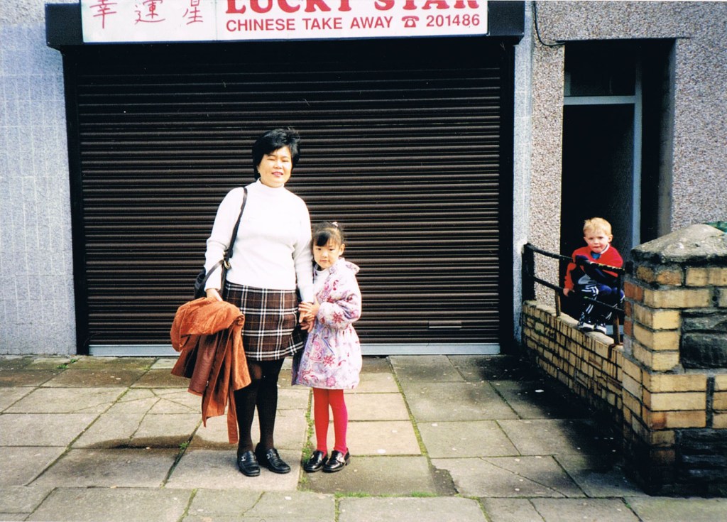 Angela Hui and her mum outside 'Lucky Star' Chinese takeaway in Wales, 1995