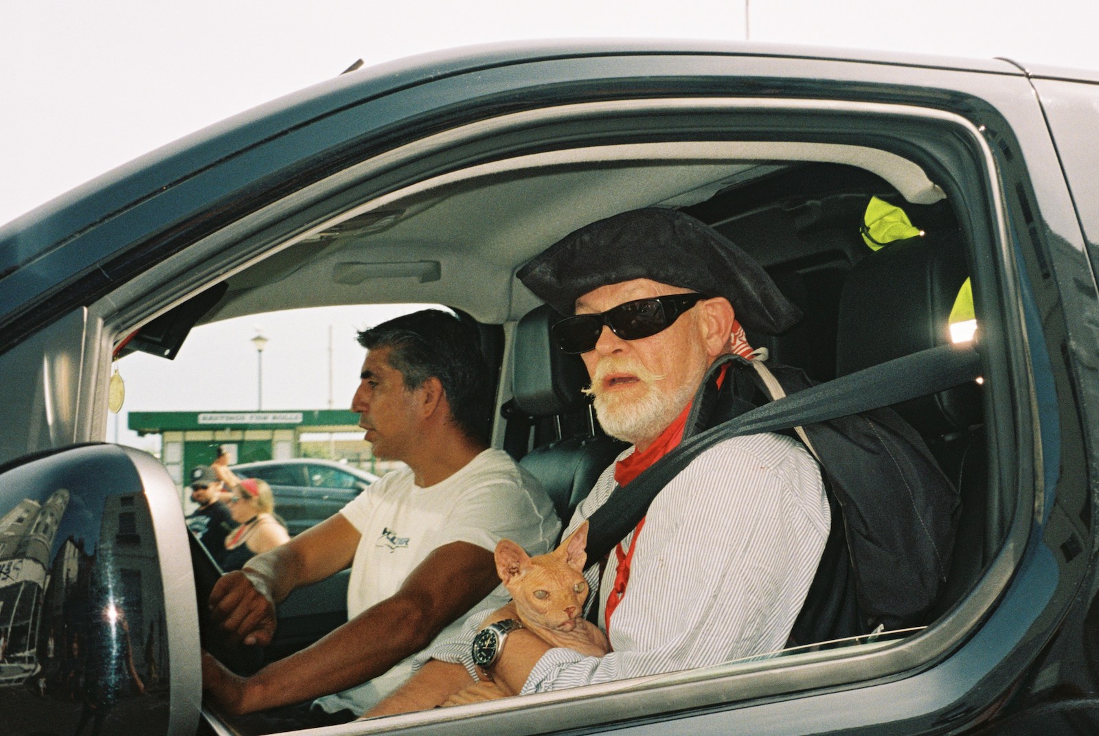 Two pirate fanatics in their car on 'Pirate Day' in Hastings