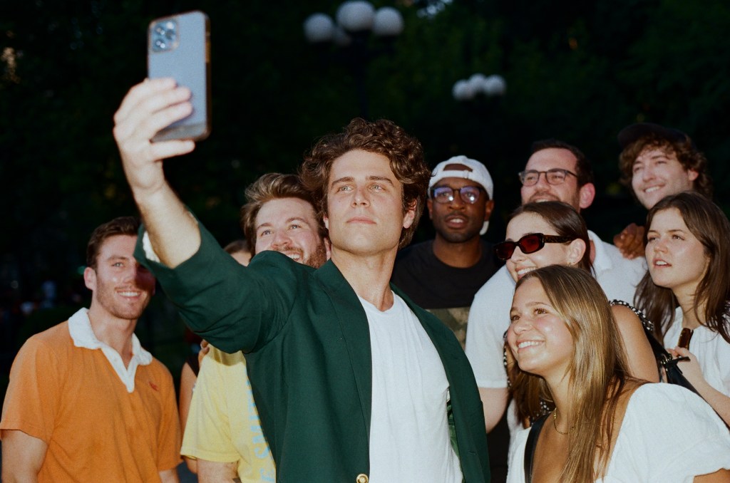 Michael Thomas White takes a selfie with his fans at Union Square Park