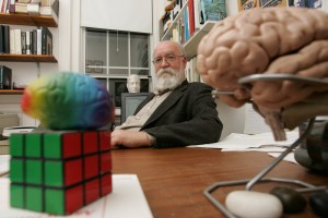 Daniel Dennett sits at his desk.