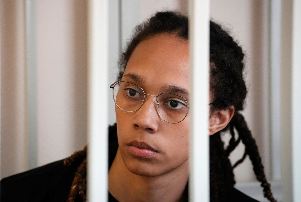 WNBA star and two-time Olympic gold medalist Brittney Griner sits in a cage at a court room prior to a hearing, in Khimki just outside Moscow, Russia, Wednesday, July 27, 2022.