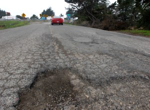 Potholes. One two three four five six of them.