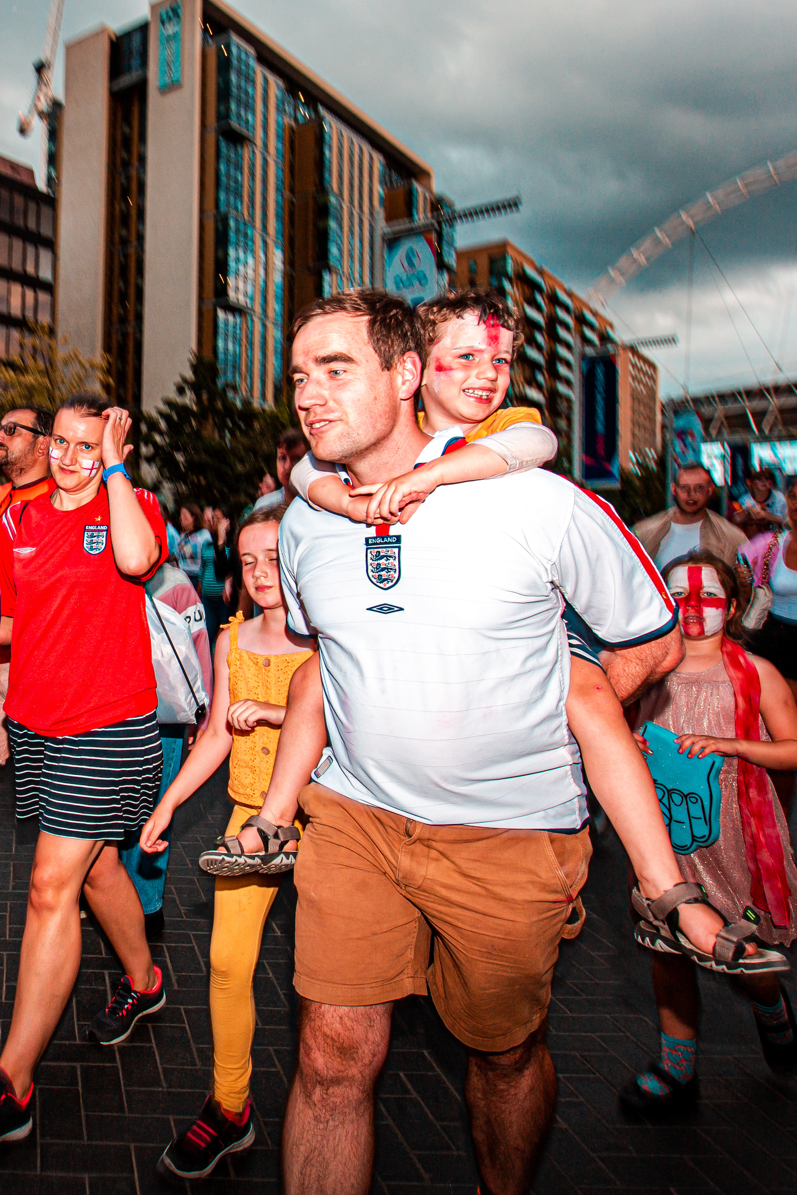 Joyful football fans outside Wembley Stadium following the Women's Euro 2022 Final