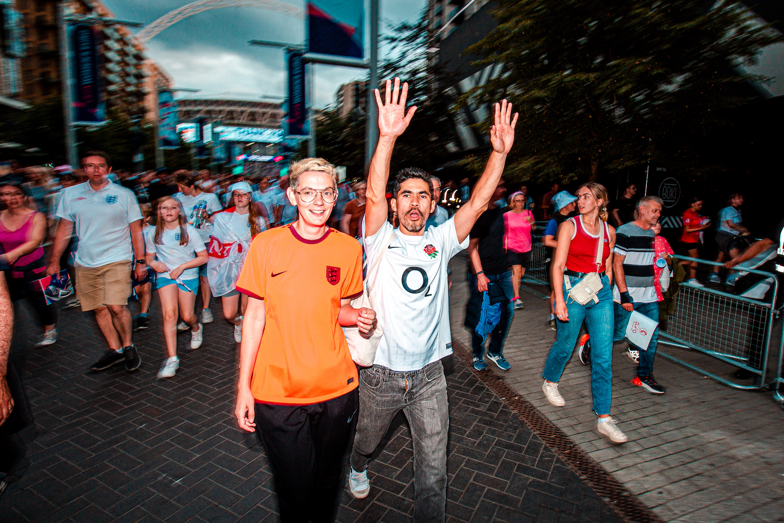 Joyful football fans outside Wembley Stadium following the Women's Euro 2022 Final