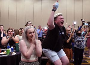 Supporters Alie Utley and Joe Moyer (R) react to the failed constitutional amendment proposal at the Kansas Constitutional Freedom Primary Election Watch Party in Overland Park, Kansas on August 2, 2022.