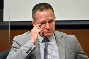 Former Louisville Police officer Brett Hankison wipes a tear from his eye as he is questioned by his defense attorney Wednesday, March 2, 2022, in Louisville, Kentucky. (AP Photo/Timothy D. Easley, Pool)