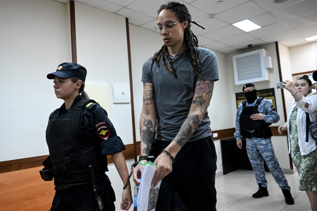 Basketball player Brittney Griner, who was detained at Moscow's Sheremetyevo airport and later charged with illegal possession of cannabis, leaves the courtroom before the court's final decision in Khimki outside Moscow, on August 4, 2022.