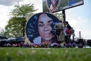 Protesters and volunteers prepare a Breonna Taylor art installation on June 5, 2021 in Louisville, Kentucky. The event commemorated what would have been Breonna Taylor’s 28th birthday. (Jon Cherry/Getty Images)