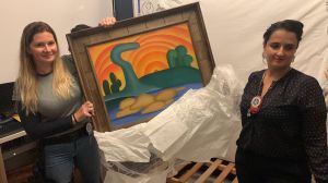 Police display one of Brazil's most famous paintings, Sol Poente by Tarsila do Amaral, after discovering it hidden under a bed.