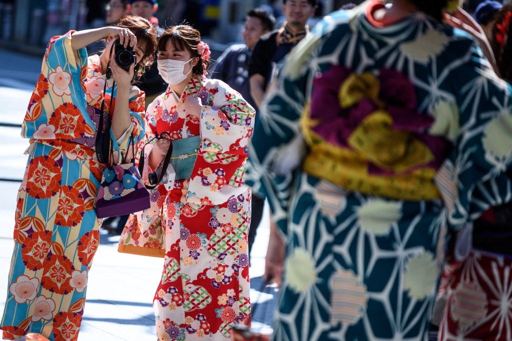 WOMEN WEARING TRADITIONAL JAPANESE KIMONOS. ​PHOTO: PHILIP FONG/AFP