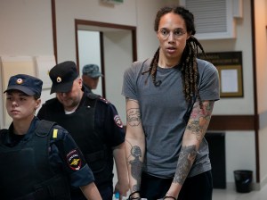 WNBA star and two-time Olympic gold medalist Brittney Griner is escorted from a court room ater a hearing, in Khimki just outside Moscow, Russia, Thursday, August, 4, 2022.