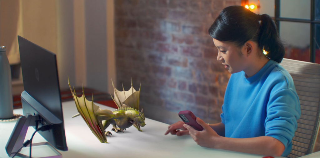 A screenshot from the commercial for HBO's Dracarys app, featuring a woman feeding her virtual dragon.