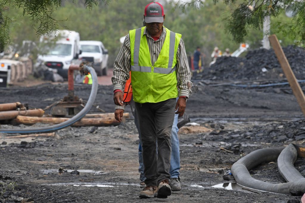 Rescue personnel take part in the operation to reach 10 miners that have been trapped in a flooded coal mine for more than a week, in the community of Agujita, Sabinas Municipality, Coahuila State, Mexico, on August 16, 2022. (Photo by PEDRO PARDO/AFP via