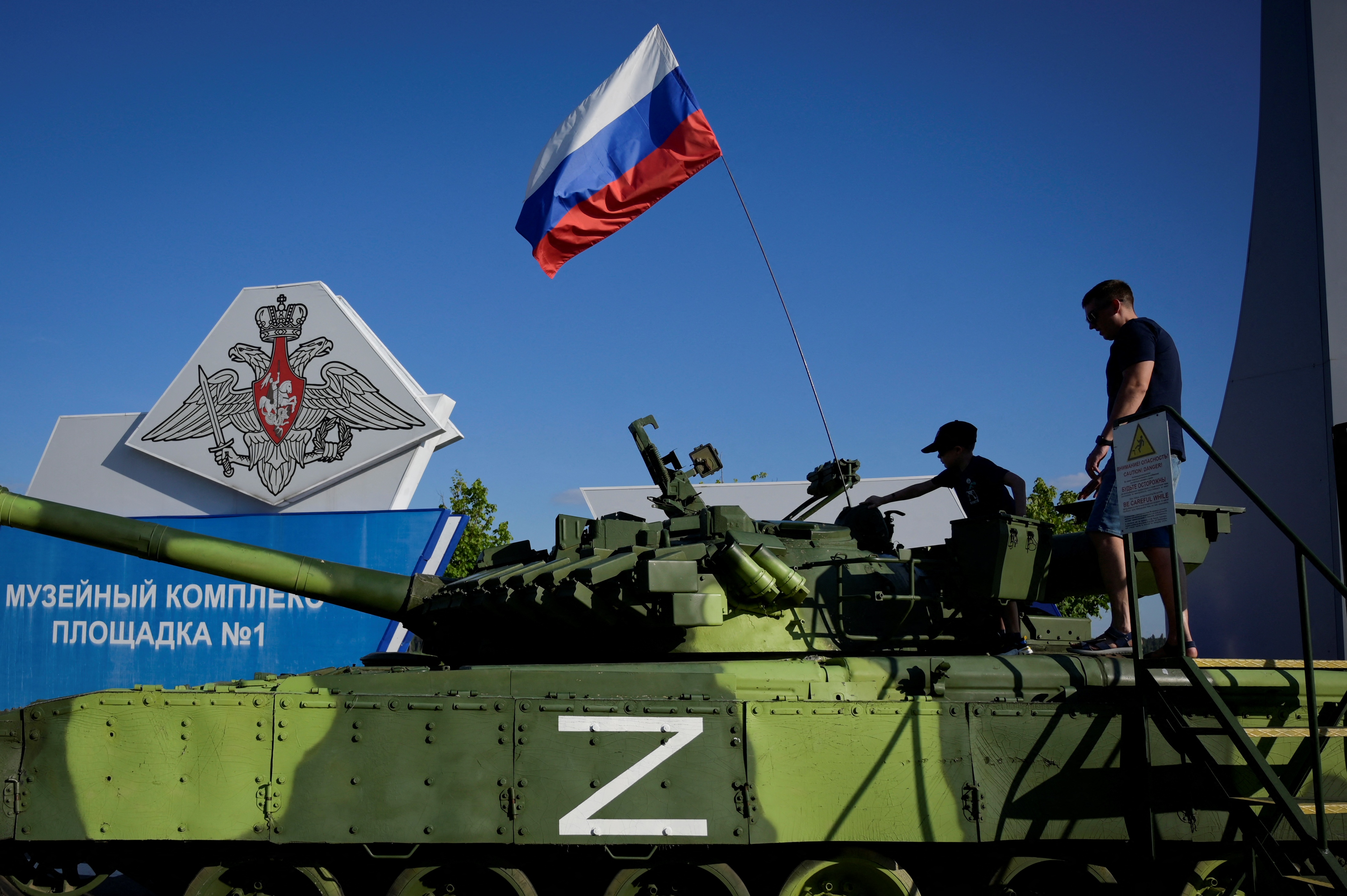 Visitors in Moscow inspect a military vehicle with the letter Z, which has become a symbol of support for the Russian invasion of Ukraine. Photo: NATALIA KOLESNIKOVA/AFP via Getty Images