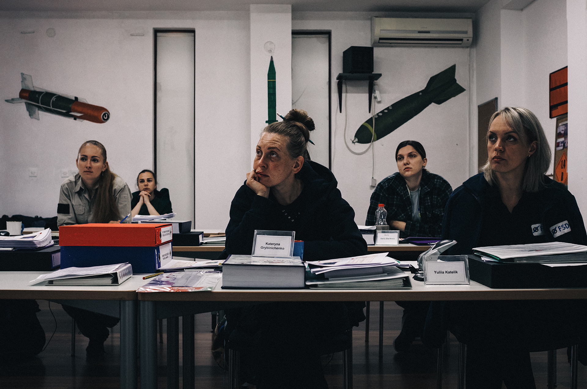 A group of Ukrainian women attend a lecture given in a classroom at the MAT Kosovo compound in Peja.