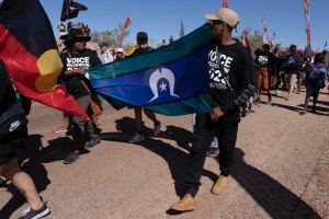 ​Youth campaigners for a Voice to Parliament march in memory of Vincent Lingiari, on Gurindji country.